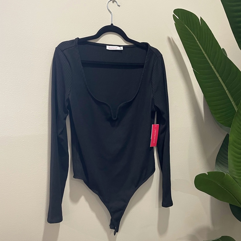 Black long sleeve ribbed bodysuit with snap crotch and wire v-neck detail